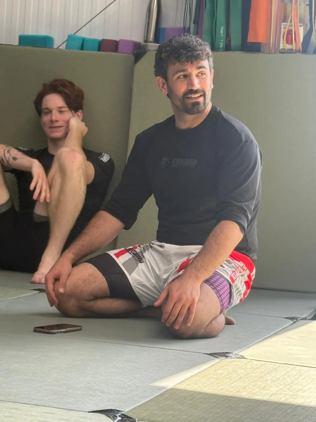 Ben Zarif coaching on the mats