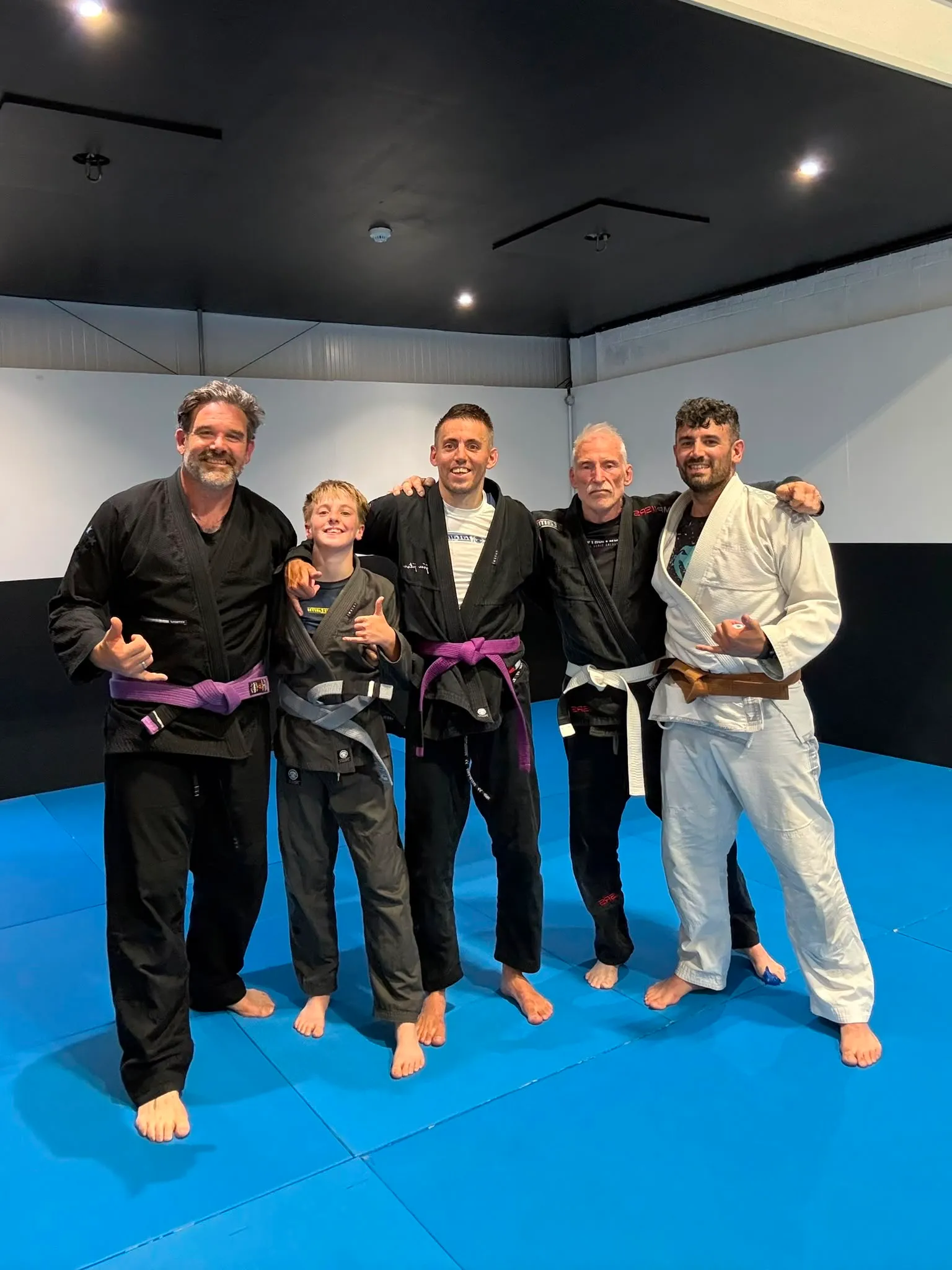 Five members in gis together after a Friday night gi class at Rebel Combat Sports in Eastbourne