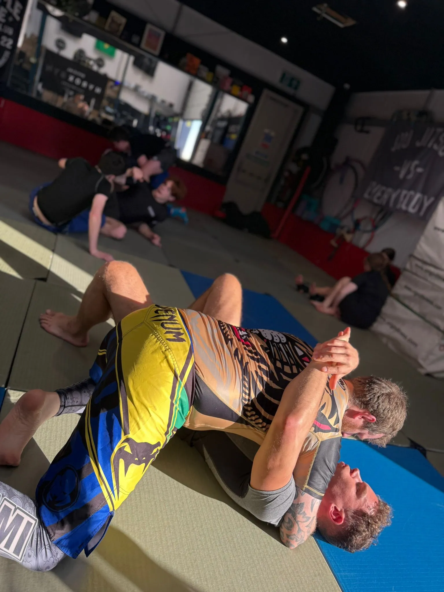 Experienced grapplers rolling at open mat — Rebel Combat Sports, Eastbourne